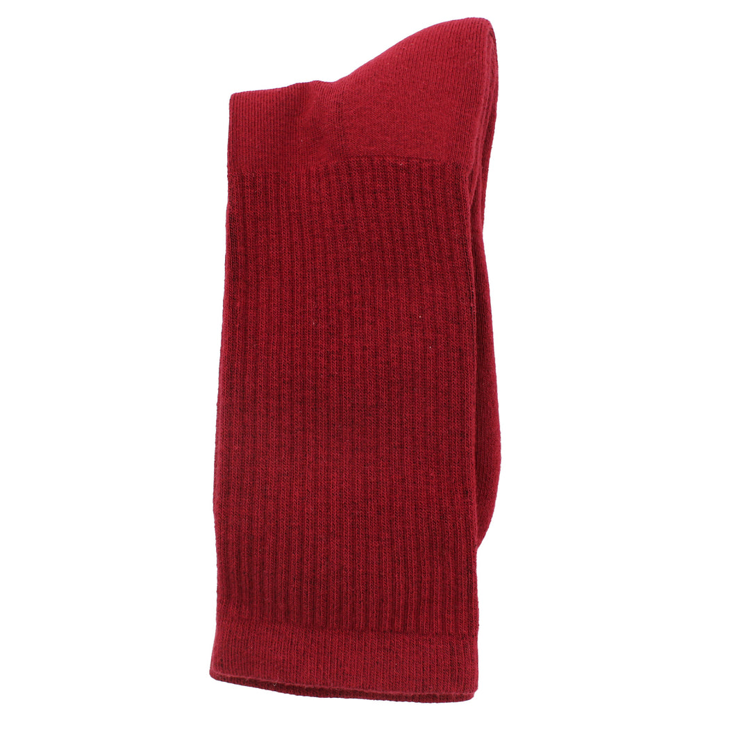 Red knitted socks on a white background