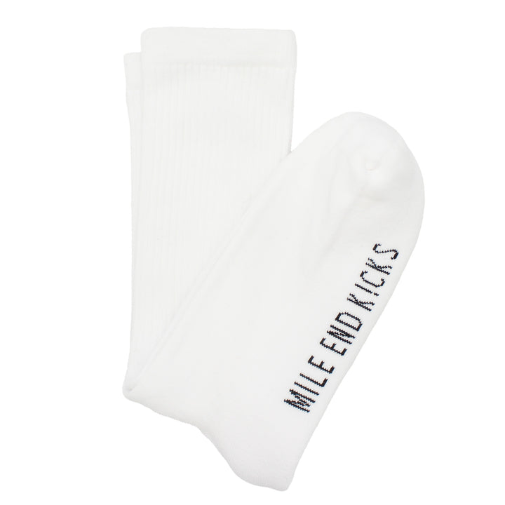 White socks with 'Mile End Kicks' text on a white background
