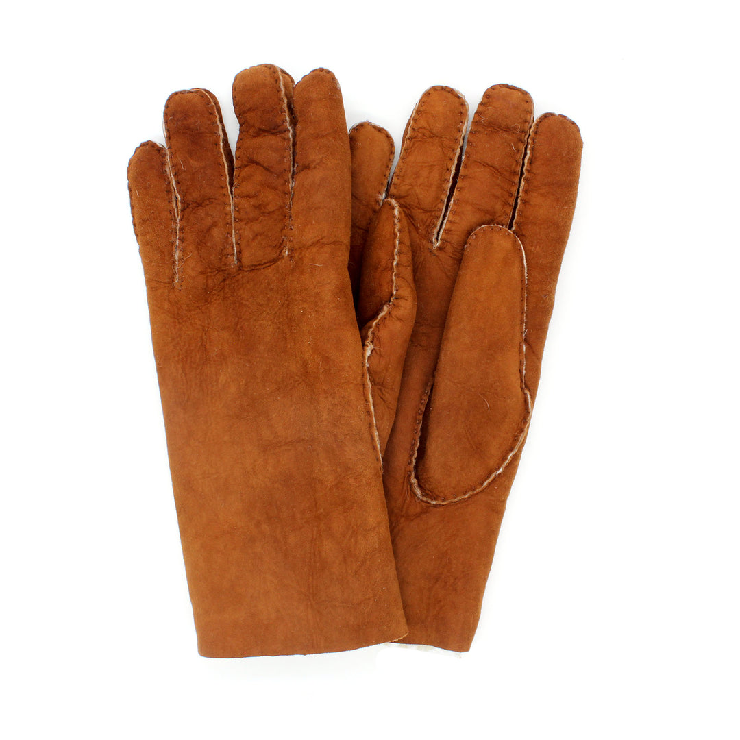 Brown leather glove on a white background