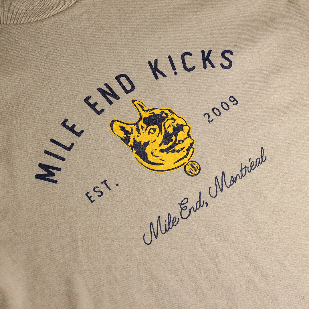 Beige t-shirt with 'Mile End Kicks' logo and text on a beige background