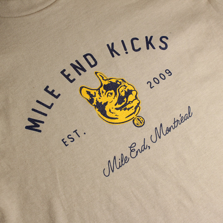 Beige t-shirt with 'Mile End Kicks' logo and text on a beige background