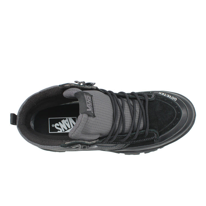 Black and gray sneaker with 'Vans' logo on a white background