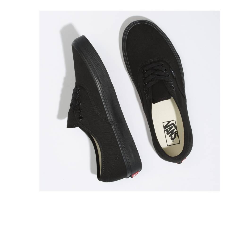 Vans Authentic low-top sneakers in a classic canvas design, featuring sturdy uppers in seasonal colors. The iconic rubber waffle outsole and lace-up closure provide a timeless look for creative and casual styles. Black/Black color and Top and side angle view.